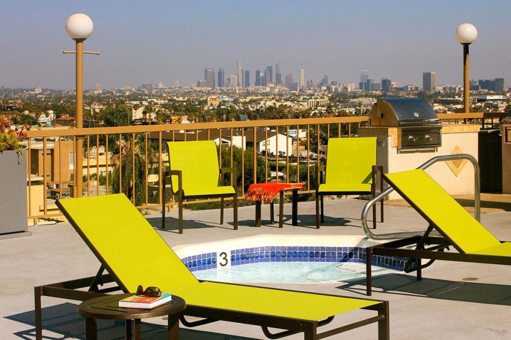 A luxurious balcony with comfortable lounge chairs and a refreshing hot tub awaits you in these stunning apartments for rent in Hollywood, CA. Enjoy the ultimate relaxation and serenity that comes with this unparalleled amenity in