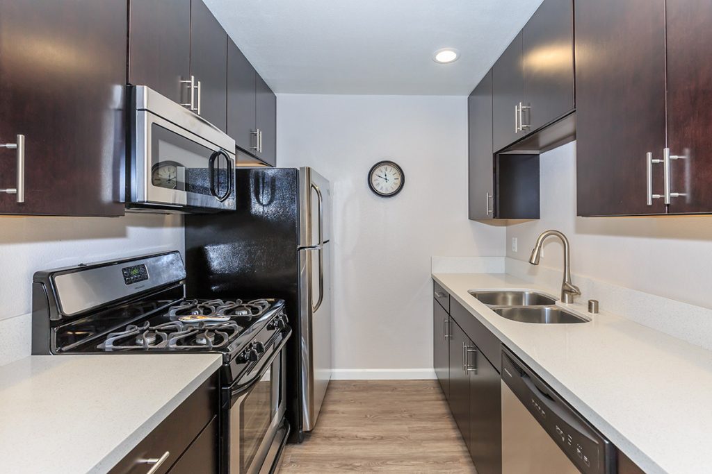 This Hollywood CA apartment features stainless steel appliances and wood cabinets.