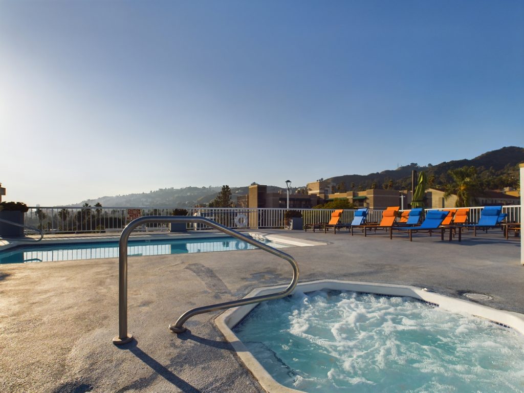 Description: A rooftop hot tub with a breathtaking view of the mountains, available for rent in Hollywood CA.