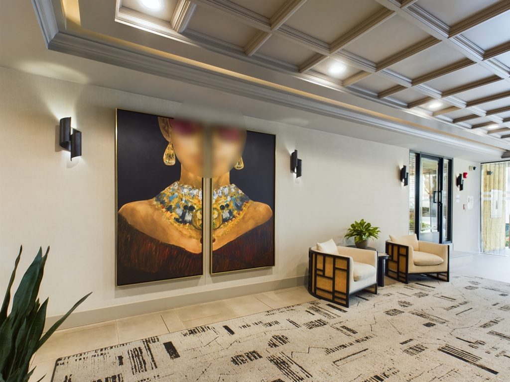 In the heart of Hollywood CA, discover a modern lobby adorned with a captivating and sizable painting on the wall.