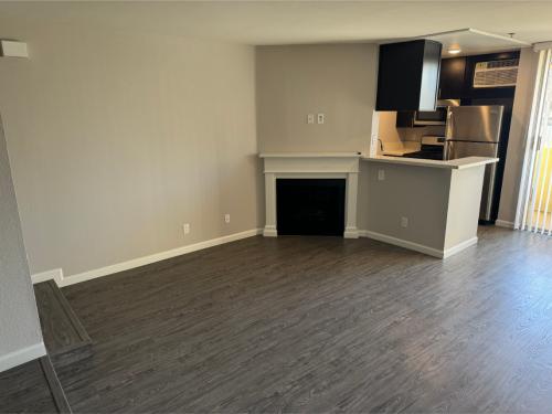 Apartments in Hollywood, CA, Studio Apartment - Plan E Livng Area with Fireplace and View to Kitchen